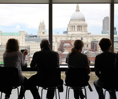 People looking at London skyline