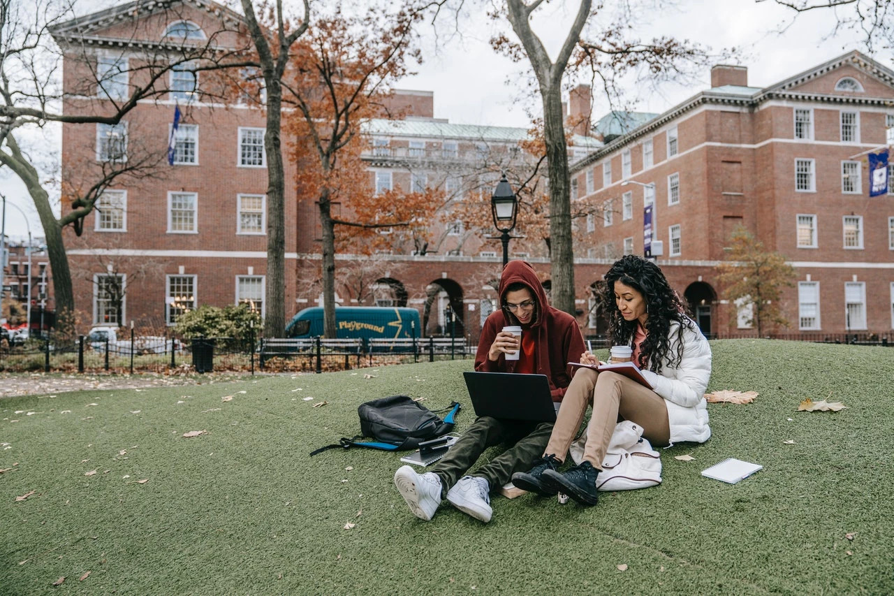 Students sitting on grass